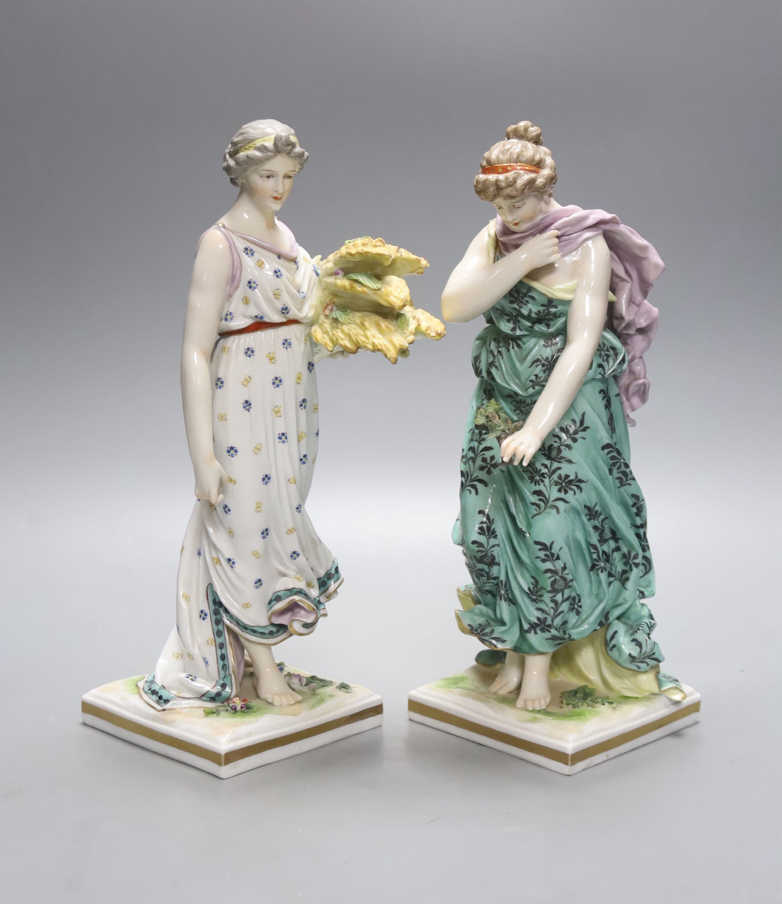 A pair of Frankenthal style figurines 'Spring' and 'Autumn', height 27cm